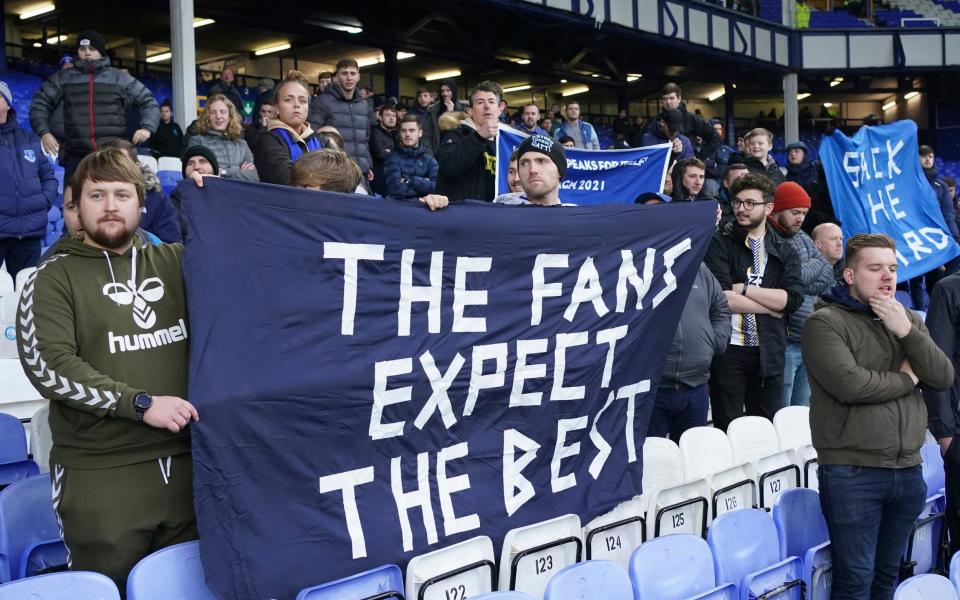 Fans protest against the Everton board after the English Premier League soccer match between Everton and Aston Villa at the Goodison Park stadium, in Liverpool, England, Saturday Jan. 22, 2022 - AP