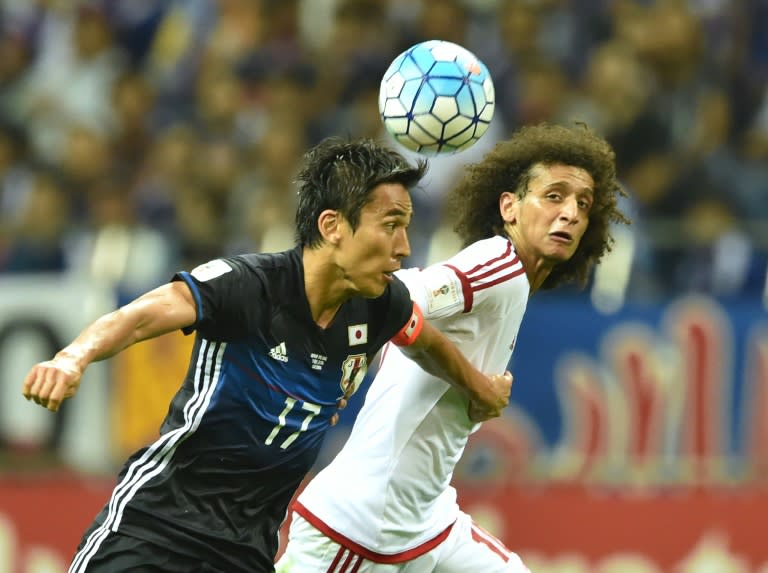 United Arab Emirates' Omar Abdulrahman (right) battles for the ball with Japan's Makoto Hasebe in their World Cup qualifier in Saitama on September 1, 2016