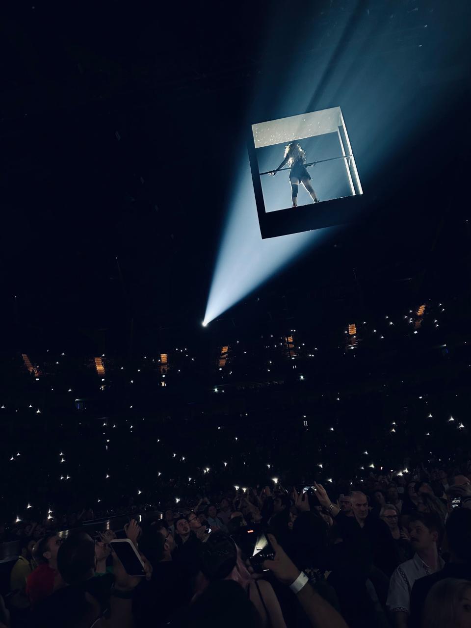 Madonna takes flight over the heads of fans while singing "Live to Tell" during The Celebration Tour.