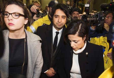 Jian Ghomeshi (C), a former celebrity radio host who has been charged with multiple counts of sexual assault, leaves court alongside his lawyer Marie Henein (R) in Toronto, January 8, 2015. REUTERS/Mark Blinch