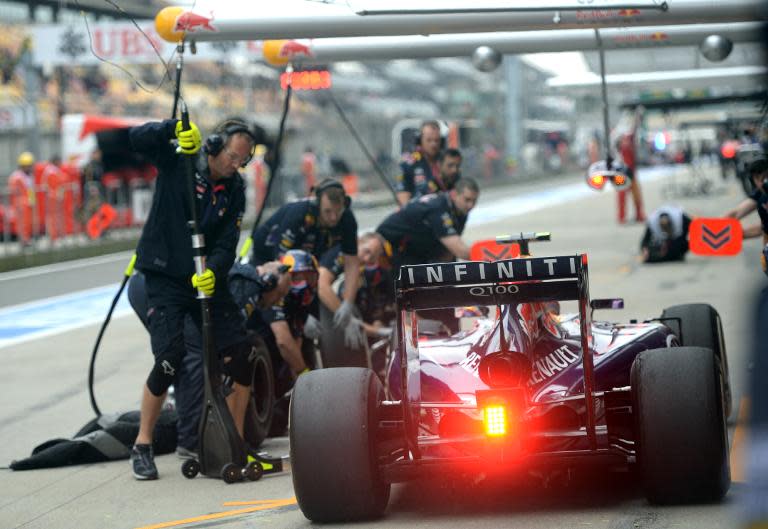 Infiniti Red Bull driver Daniel Ricciardo of Australia takes his car in for a pit-stop during the first practice session of the Formula One Chinese Grand Prix, in Shanghai, on April 18, 2014