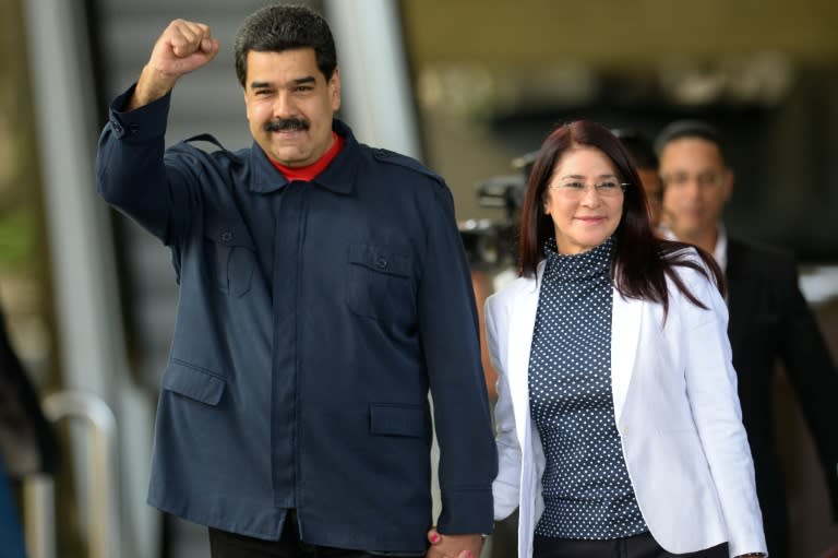 Venezuelan President Nicolas Maduro (L) is struggling to pay for a vast program supplying leftist allies with cheap oil