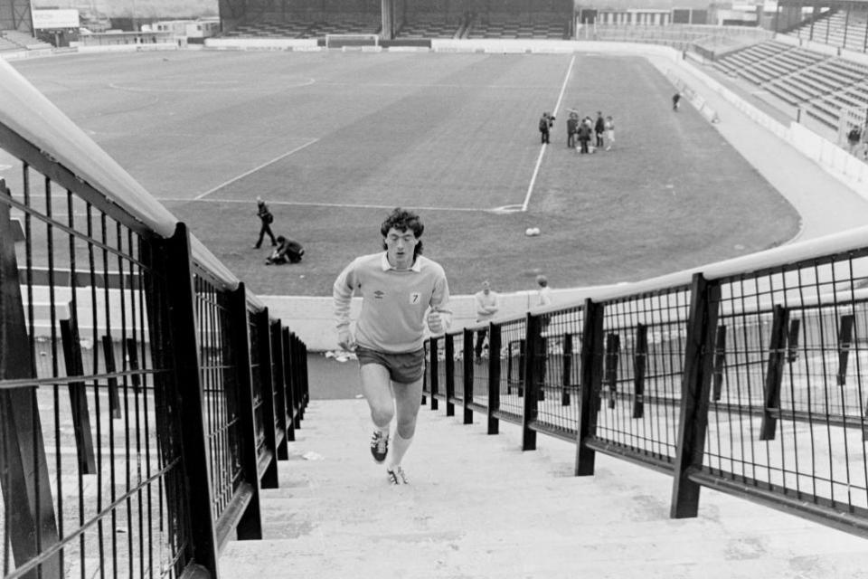 Watford Observer: David Bardsley is snapped running back up the steps as some media activities continue on the pitch behind him