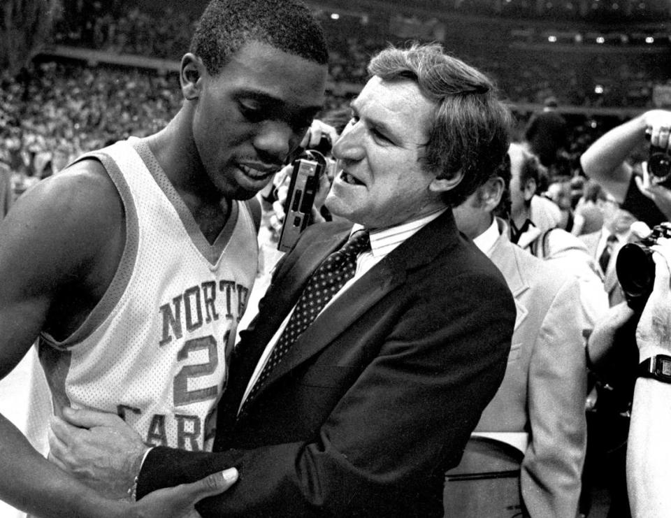 UNC coach Dean Smith congratulates point guard Jimmy Black after the Tar Heels defeated the Georgetown Hoyas to win the 1982 National Championship in New Orleans, April 7, 1982.