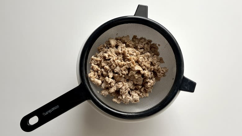 ground turkey in colander