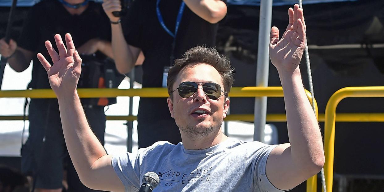 elon musk hands up