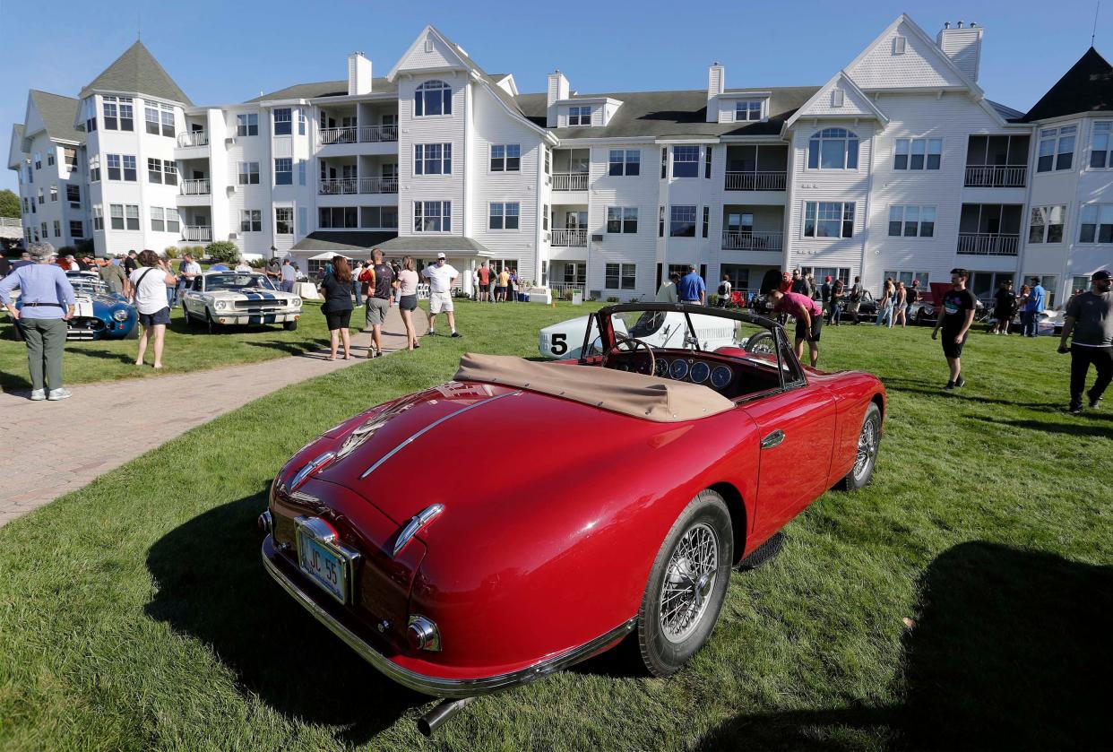 The curves of a vintage Aston Martin graces the lawn at Gather on the Green at the Osthoff Resort, Saturday, September 18, 2021, at Elkhart Lake, Wis.