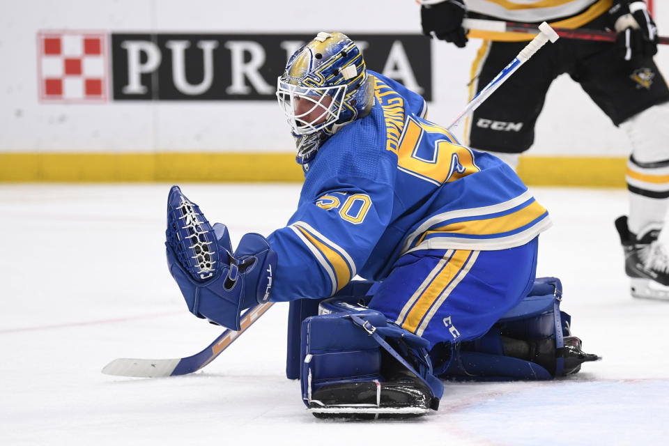 St. Louis Blues goaltender Jordan Binnington makes a save against the Pittsburgh Penguins during the first period of an NHL hockey game, Saturday, Feb. 25, 2023, in St. Louis. (AP Photo/Jeff Le)