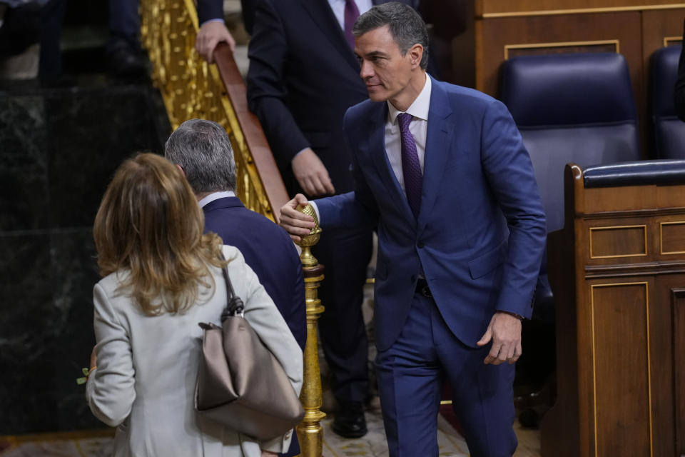 Spain's Socialist Prime Minister Pedro leaves the Spanish Parliament in Madrid, Spain, Thursday, March 14, 2024. Spain's Parliament on Thursday has approved a controversial amnesty bill aimed at forgiving crimes — both proved and alleged — committed by Catalan separatists during a chaotic attempt to hold an independence referendum six years ago. (AP Photo/Manu Fernandez)