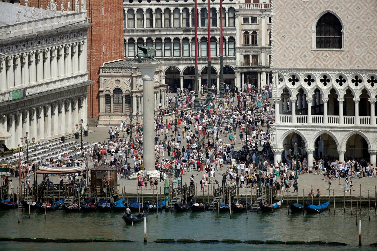 A view of the St. Mark's Square in Venice, Italy, taken on June 8, 2019. Venice authorities have rolled out a pilot program to charge day-trippers 5 euros ($5.45) apiece to enter the fragile lagoon city on peak weekends next year.