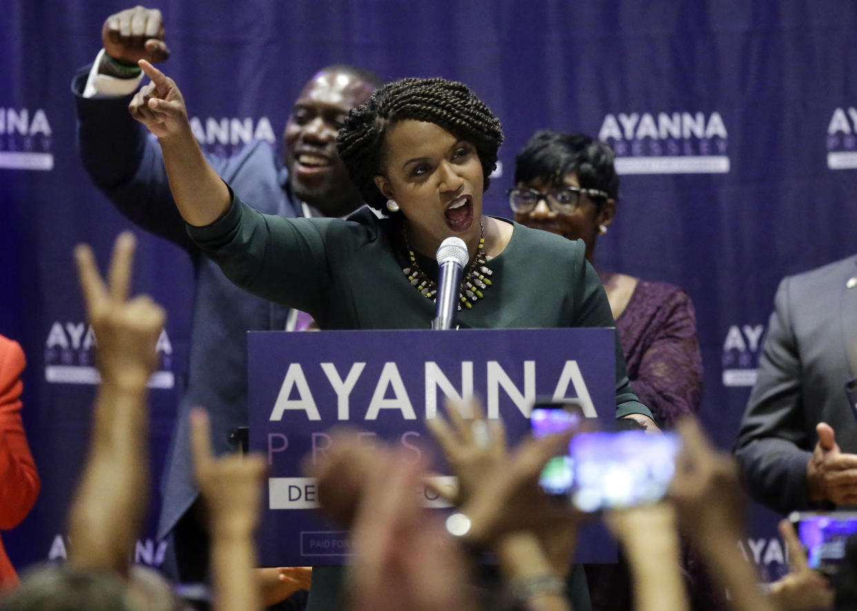 Boston City Councilor Ayanna Pressley, center, celebrates victory over U.S. Rep. Michael Capuano, D-Mass., in the 7th Congressional House Democratic primary, Tuesday, Sept. 4, 2018, in Boston. (AP Photo/Steven Senne)