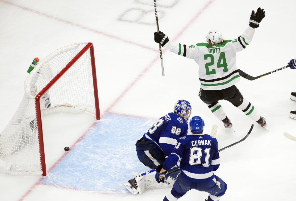 Dallas Stars left wing Roope Hintz (24) reacts as teammate Joel Kiviranta (not shown) scores past Tampa Bay Lightning goaltender Andrei Vasilevskiy (88) during second-period NHL Stanley Cup finals hockey action in Edmonton, Alberta, Saturday, Sept. 19, 2020. (Jason Franson/The Canadian Press via AP)