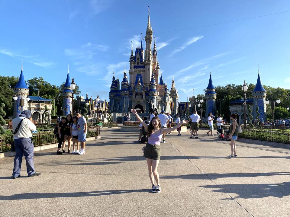 Insider reporter Amanda Krause poses in front of Disney World's Cinderella Castle.