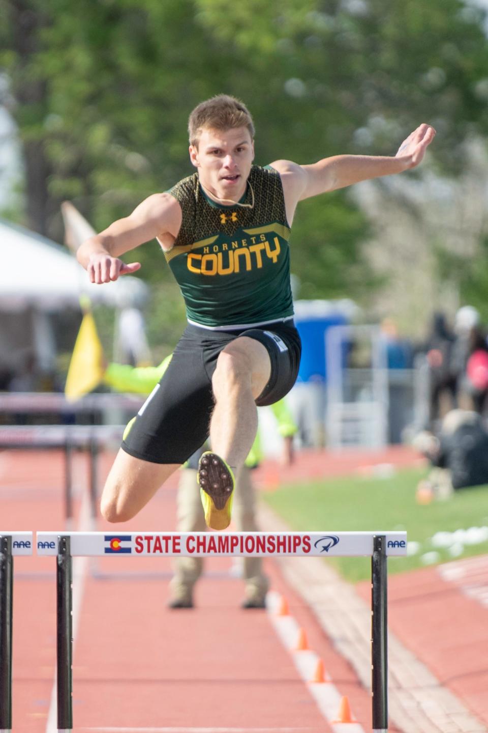 Pueblo County's Seth Sherwood soars over the final hurdle in the Class 4A 300 meter hurdle qualifying race during the CHSSA state track and field meet on Saturday, May 21, 2022 at Jeffco Stadium.