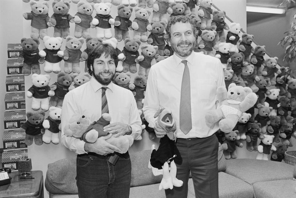 <p>(Original Caption) Sunnyvale, California: Reunited after almost 12 years, Silicon Valley technology pioneers Nolan Bushnell (right) and Steve Wozniak are shown during press conference at which they announced plans for Bushnell's Axlon, Inc. to acquire Wozniak's CL9, Inc. in a stock swap. They plan to have lots of fun building electronic toys and games together. The two companies, in joining forces, plan to share technology in making new and exciting products for kids of all ages.</p> 