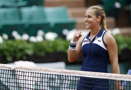 Dominika Cibulkova of Slovakia reacts after defeating Virginie Razzano of France in their women's singles match at the French Open tennis tournament at the Roland Garros stadium in Paris May 26, 2014. REUTERS/Vincent Kessler