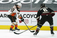 Anaheim Ducks Vinni Lettieri skates by Arizona Coyotes defenseman Jakob Chychrun (6) in the first period during an NHL hockey game, Tuesday, Jan. 26, 2021, in Glendale, Ariz. (AP Photo/Rick Scuteri)