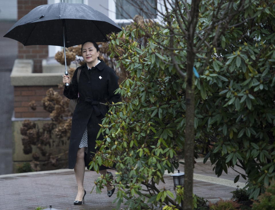 Meng Wanzhou, chief financial officer of Huawei, leaves her home to go to B.C. Supreme Court in Vancouver, Thursday, January, 23, 2020. Wanzhou is in court for hearings over an American request to extradite the executive of the Chinese telecom giant Huawei on fraud charges. (Jonathan Hayward/The Canadian Press via AP)