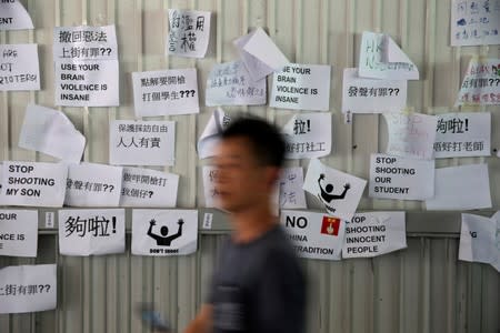 Notes are posted on a board following protests against the proposed extradition bill, in Hong Kong, China