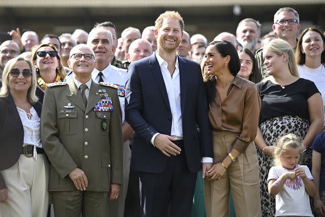 <p>Sascha Schuermann/Getty Images for the Invictus Games Foundation</p> Prince Harry and Meghan Markle at the 2023 Invictus Games