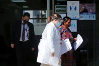 Member of Guatemalan Maya families, who feared their relatives were among 19 bodies found shot and burnt at the weekend in a remote part of northern Mexico, arrive to the Faculty of Medicine for DNA samples to help in the identification, in Guatemala City