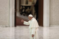 Pope Francis gives his thumbs up as he salutes faithful at the end of his weekly general audience in the Paul VI Hall at the Vatican, Wednesday, Oct. 28, 2020. Pope Francis has blamed “this lady COVID” for forcing him to keep his distance from the faithful during his general audience, which was far smaller than usual amid soaring coronavirus infections in Italy. (AP Photo/Alessandra Tarantino)