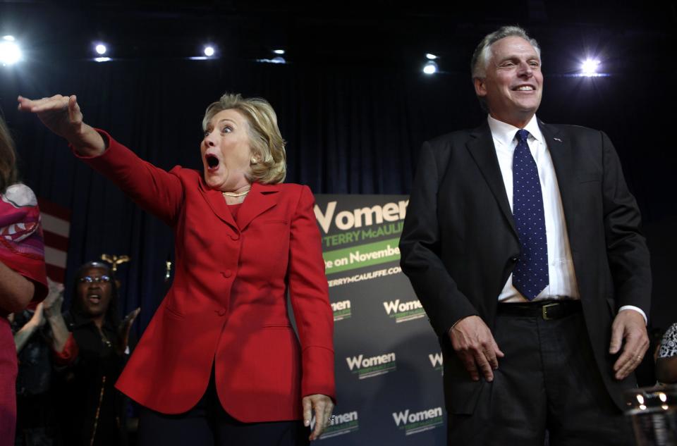 Former U.S. Secretary of State Hillary Clinton greets the audience at an event to endorse Virginia gubernatorial candidate and former DNC chairman Terry McAuliffe (R) at The State Theatre in Falls Church, Virginia, October 19, 2013. REUTERS/Yuri Gripas (UNITED STATES - Tags: POLITICS ELECTIONS)