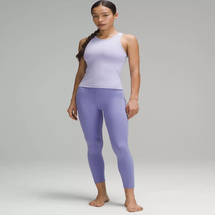 model wearing the lilac leggings with lighter purple top