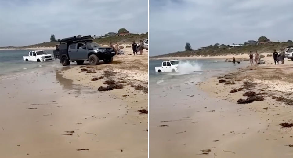 The Izuzu pulling the white Toyota ute from the water as bystanders watch on. 