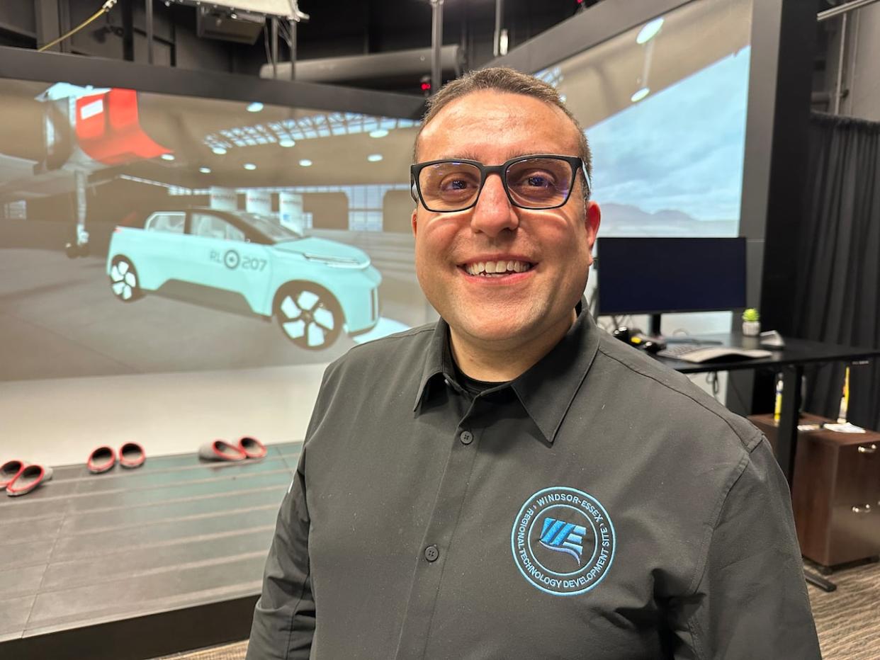 Ed Dawson, the interim Executive Director of the Invest Windsor Automobility and Innovation Centre poses at the VR CAVE which the Arrow was produced virtually. (Dale Molnar/CBC - image credit)