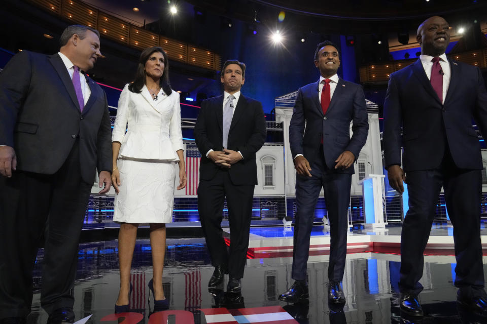 Republican presidential candidates from left, former New Jersey Gov. Chris Christie, former UN Ambassador Nikki Haley, Florida Gov. Ron DeSantis, businessman Vivek Ramaswamy and Sen. Tim Scott, R-S.C., stand on stage before a Republican presidential primary debate hosted by NBC News Wednesday, Nov. 8, 2023, at the Adrienne Arsht Center for the Performing Arts of Miami-Dade County in Miami. (AP Photo/Wilfredo Lee)