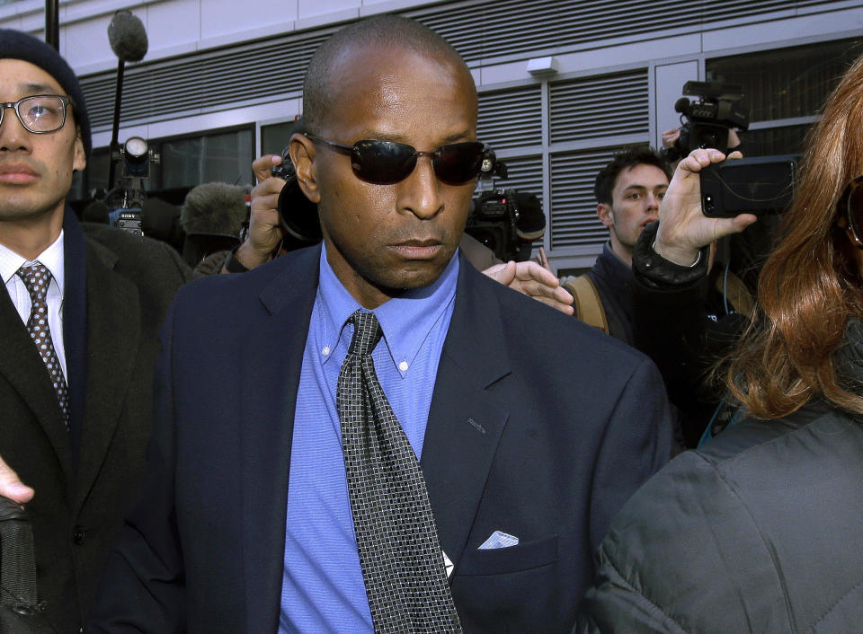 FILE - In this March 28, 2019 file photo, Rudy Meredith, former Yale women's soccer coach, departs federal court in Boston where he pleaded guilty to charges in a nationwide college admissions bribery scandal. A total of 50 people have been charged, including 33 parents, 10 coaches and college athletics officials, and seven others. (AP Photo/Steven Senne, File)