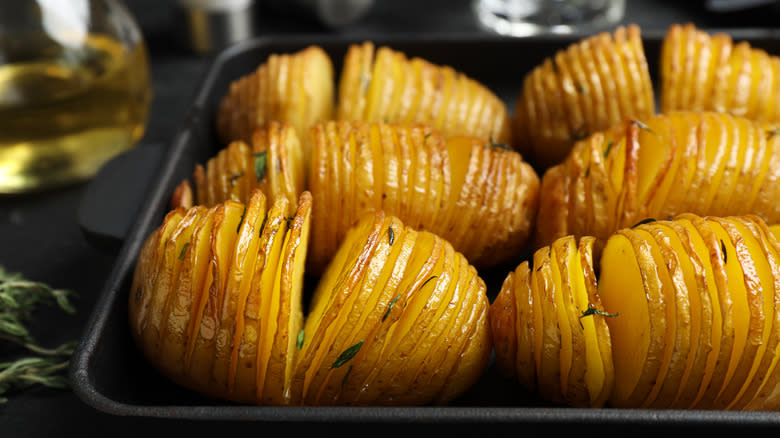 Hasselback potatoes on baking sheet