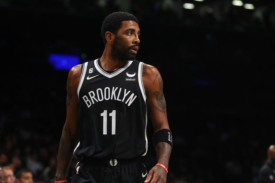 Brooklyn Nets point guard Kyrie Irving was suspended eight games for his refusal to condemn an antisemitic film he shared on Twitter. (Mike Stobe/Getty Images)