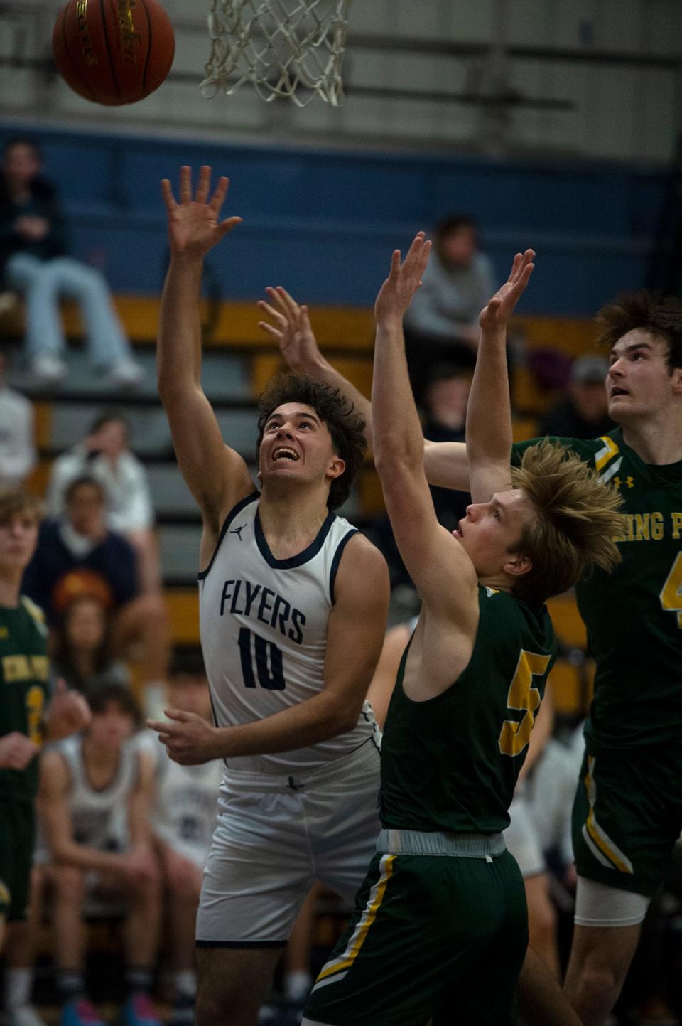 Framingham High School sophomore Andrew Lima drives the lane against King Philip in the finals of the Framingham Holiday Hoopla tournament, Dec. 29, 2022.