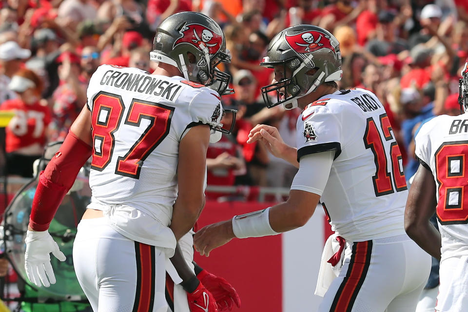 TAMPA, FL - SEPTEMBER 19: Tampa Bay Buccaneers Tight End Rob Gronkowski (87) scores a touchdown and is congratulated by Quarterback Tom Brady (12) during the regular season game between the Atlanta Falcons and the Tampa Bay Buccaneers on September 19, 2021 at Raymond James Stadium in Tampa, Florida. (Photo by Cliff Welch/Icon Sportswire via Getty Images)