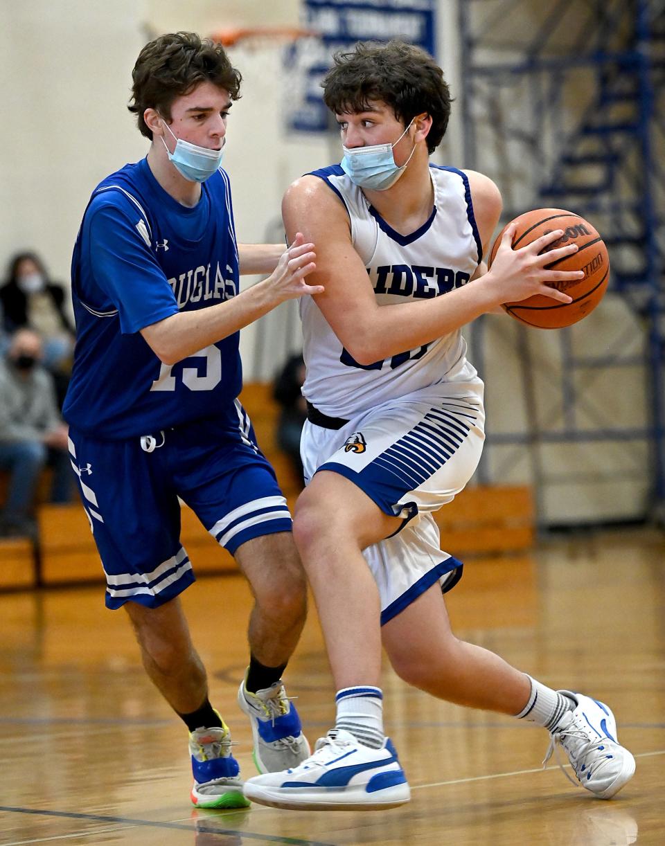 Hopedale's Ollie Radcliffe is guarded by Douglas' Billy George.
