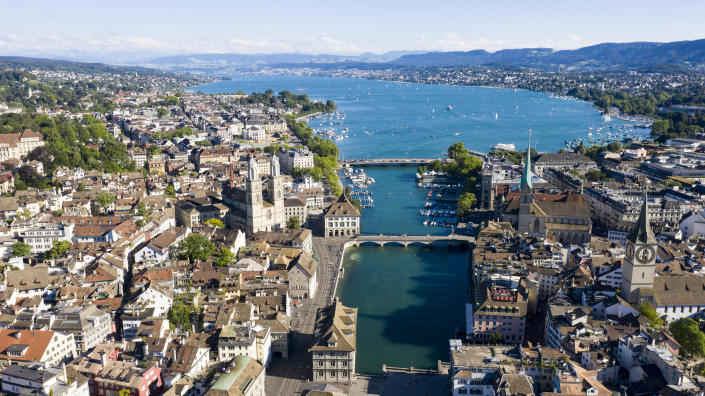 ZURICH, SWITZERLAND - JULY 12: Aerial drone view of downtown Zurich, Limmat river, Lake Zurich and Grossmuenster church stands during the coronavirus pandemic on July 12, 2020 in Zurich, Switzerland .  Switzerland has largely lifted most of its coronavirus lockdown measures and has so far recorded around 33,000 infections.  / Credit: Christian Ender / Getty Images