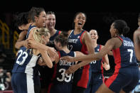 France players celebrate on the court at the end of a women's basketball quarterfinal round game against Spain at the 2020 Summer Olympics, Wednesday, Aug. 4, 2021, in Saitama, Japan. (AP Photo/Eric Gay)