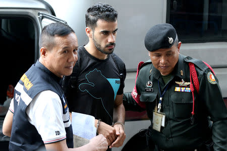 FILE PHOTO: Hakeem Al Araibi, a former member of Bahrain's national soccer team who holds a refugee status in Australia arrives at court after he was arrested last month on arrival at a Bangkok airport based on an Interpol notice issued at Bahrain's request, in Bangkok, Thailand December 11, 2018. REUTERS/Athit Perawongmetha/File Photo