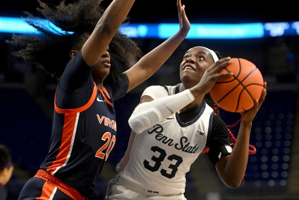 Penn State’s Johnasia Cash looks to the basket around Virginia’s Camryn Taylor during the game on Wednesday, Nov. 30, 2022.