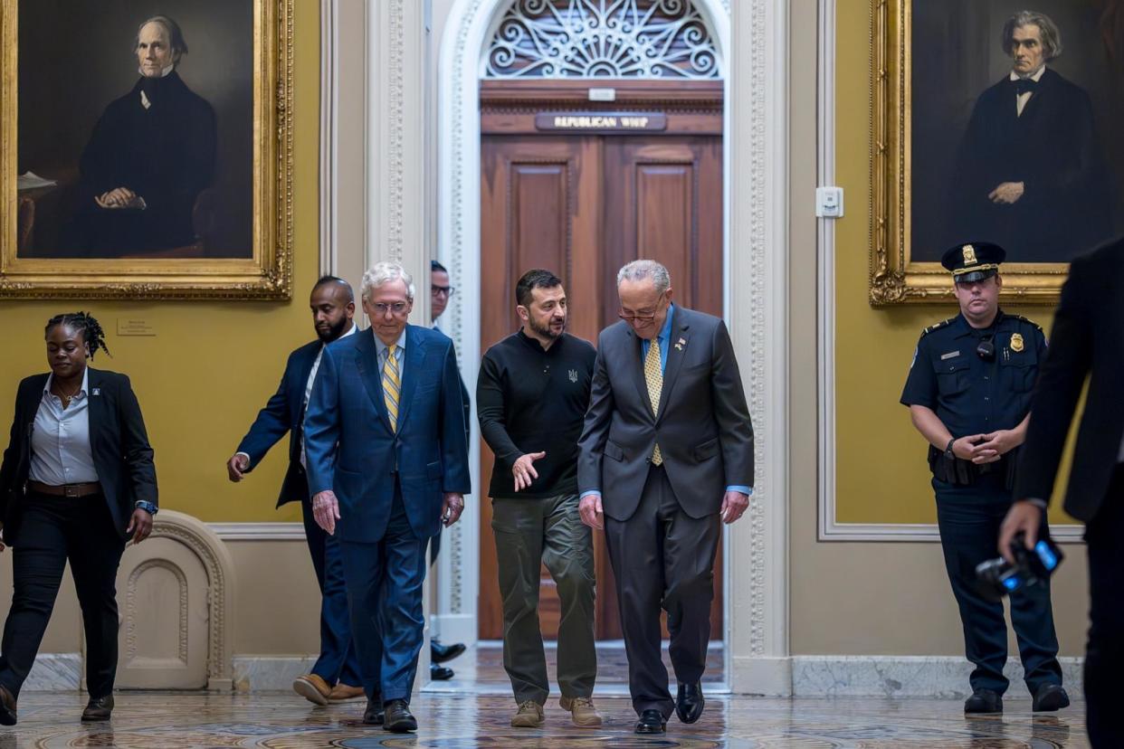 PHOTO: Ukrainian President Volodymyr Zelenskyy, center, walks with Senate Minority Leader Mitch McConnell and Senate Majority Leader Chuck Schumer, as he arrives for a briefing with lawmakers at the Capitol, Sept. 26, 2024.  (J. Scott Applewhite/AP)