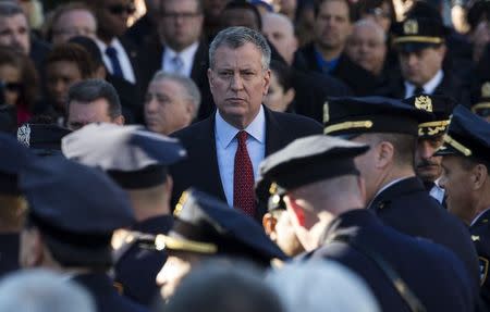 New York City Mayor Bill de Blasio exits the Christ Tabernacle Church following the funeral service for slain New York Police Department (NYPD) officer Rafael Ramos in the Queens borough of New York December 27, 2014. REUTERS/Mike Segar