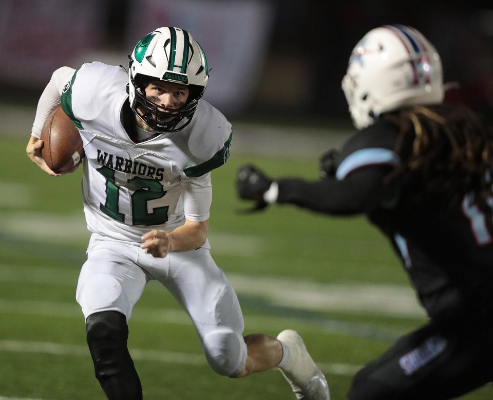 West Branch quarterback Dru Deshields looks for running room against Alliance Friday , October 7, 2022. 