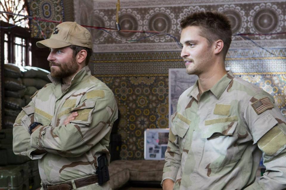 Bradley Cooper (left) and Luke Grimes on the set of ‘American Sniper’ (Warner Bros Pictures)