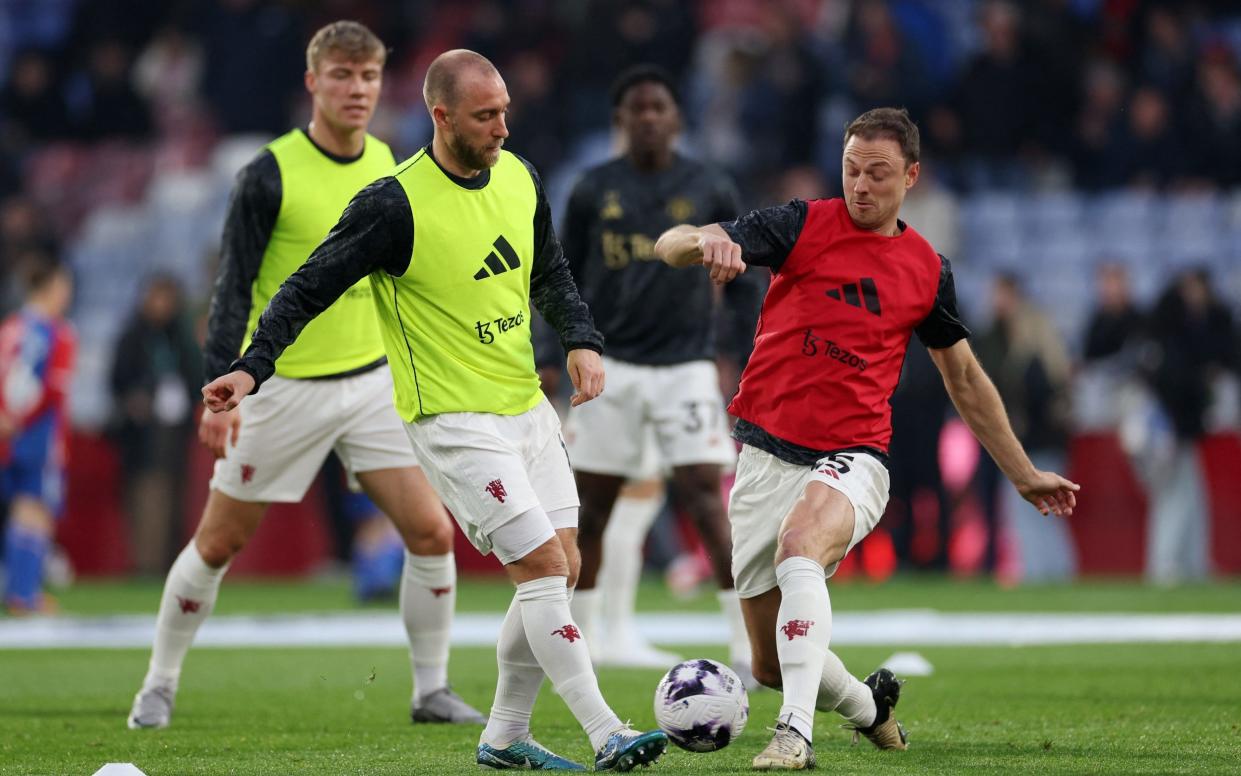 Manchester United's Christian Eriksen with teammates during the warm up before the match
