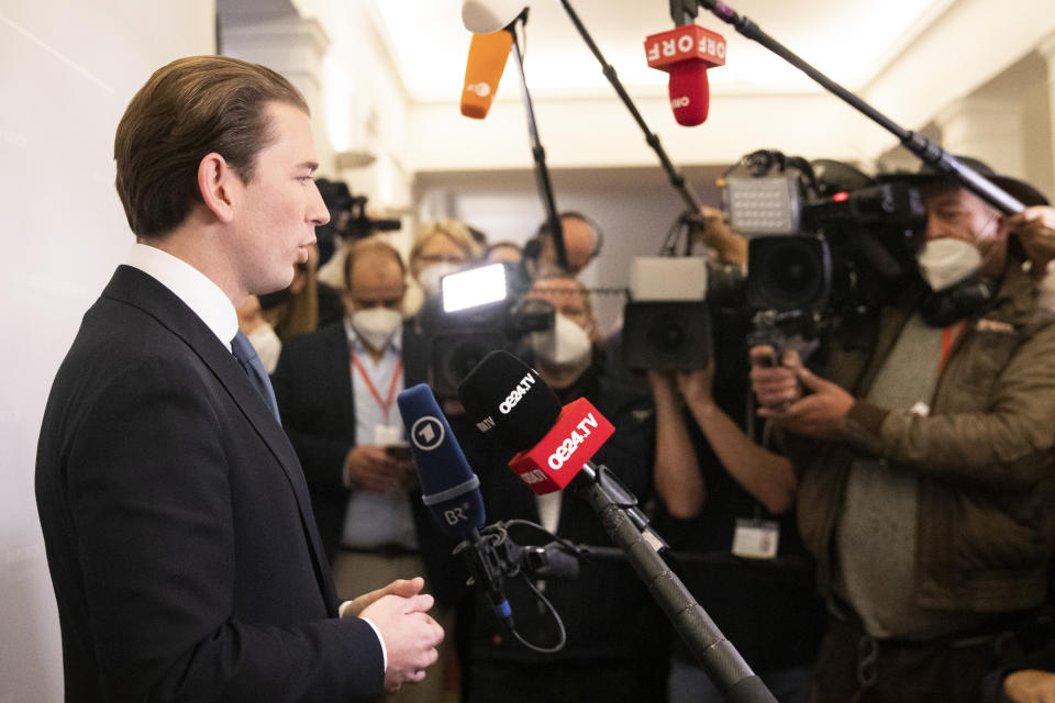 Sebastian Kurz, the former Austrian Chancellor gives an interview to the press, before the sworn-in as deputy in the Austrian Parliament in Vienna, Austria, Thursday, Oct. 14, 2021. (AP Photo/Lisa Leutner)