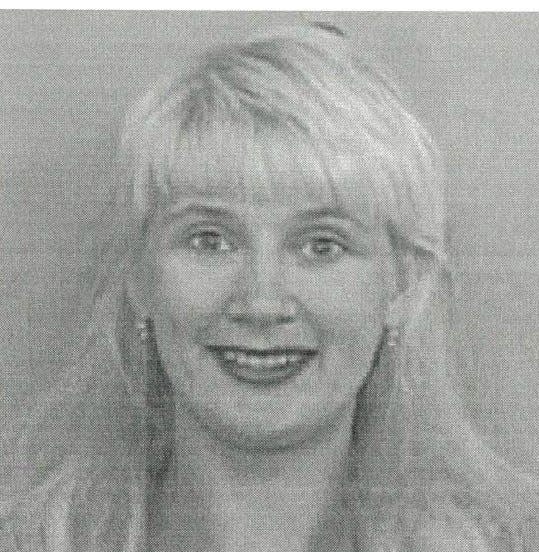 Authorities executed a search warrant Tuesday in Holton while investigating cases that included the disappearance in 2000 of Russian immigrant Yulia Shevtensko Larrison, shown here.