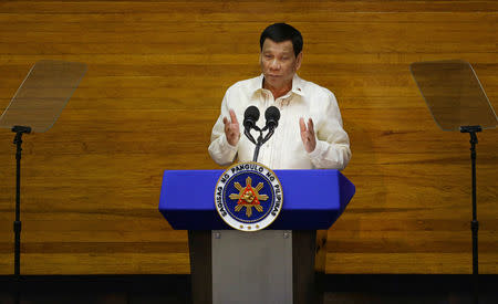 Philippine President Rodrigo Duterte delivers his State of the Nation address at the House of Representatives in Quezon city, Metro Manila, Philippines July 23, 2018. REUTERS/Czar Dancel