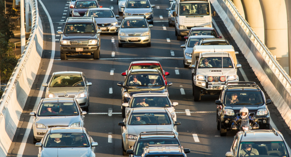 Cars sit in traffic on a highway. Double demerit penalties apply this Easter in some states.
